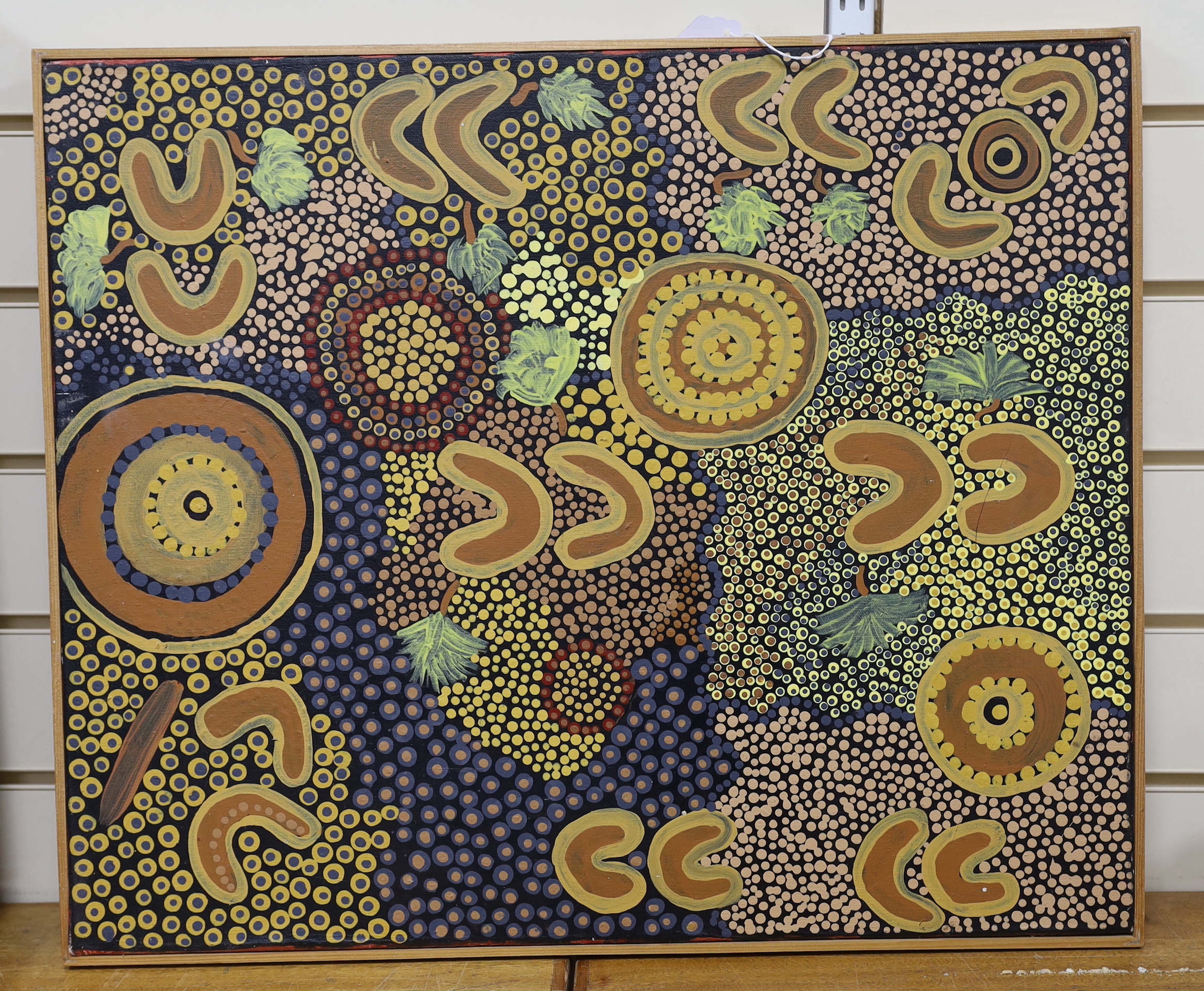 An Aboriginal decorated didgeridoo, Walpari tribe oil on canvas, a fabric painted panel and two decorated wooden sticks, canvas 50x61cm